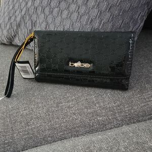 Bebe Glossy Black Wristlet with Gold Accent
